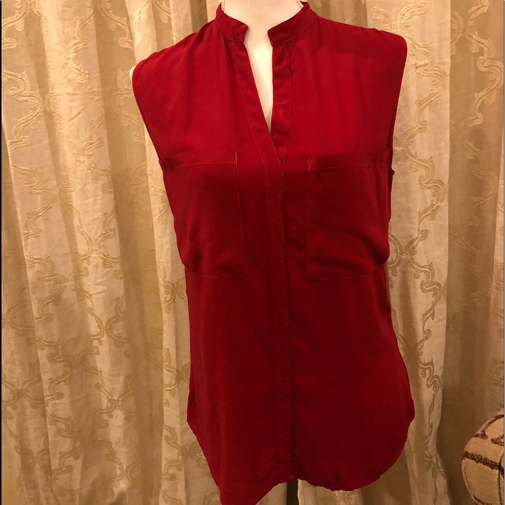 V-neck red sleeveless high front, lower in back